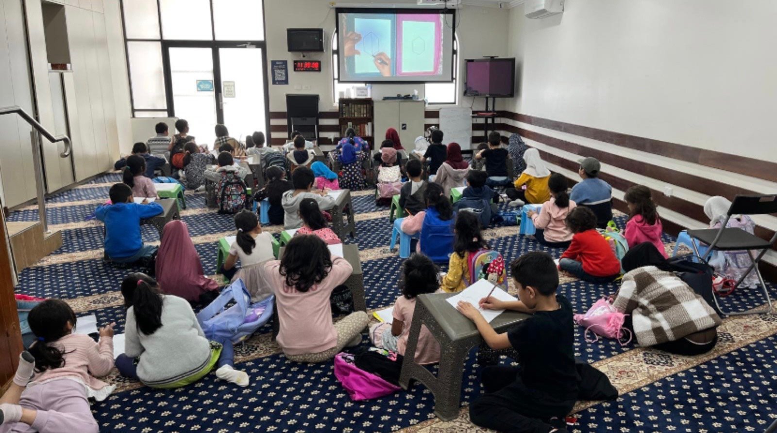 Students in an Arabic School classroom at Quakers Hill Masjid